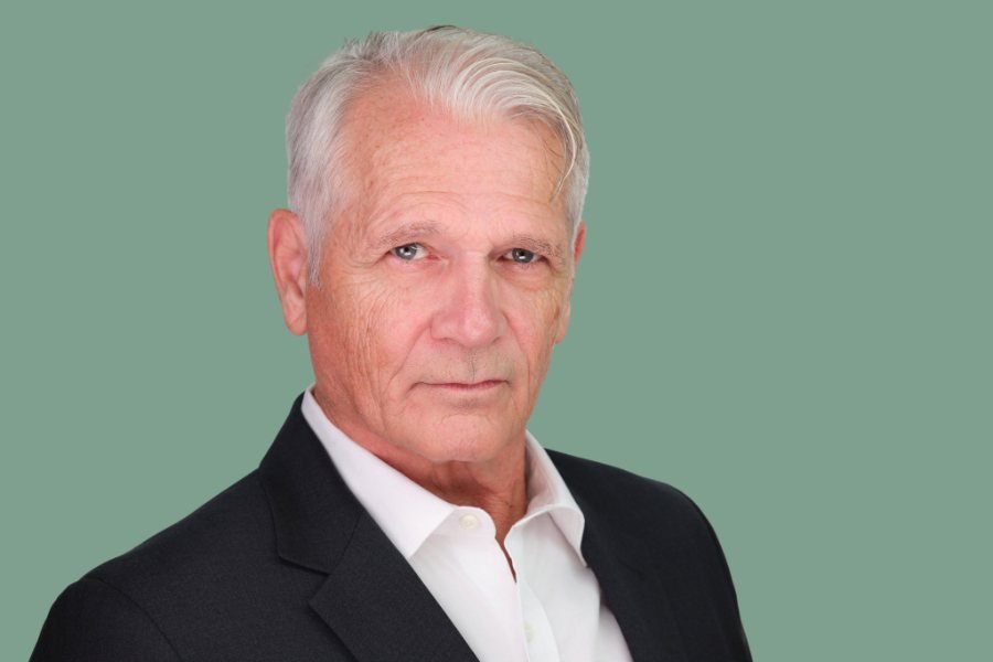 Actor headshot on a green background