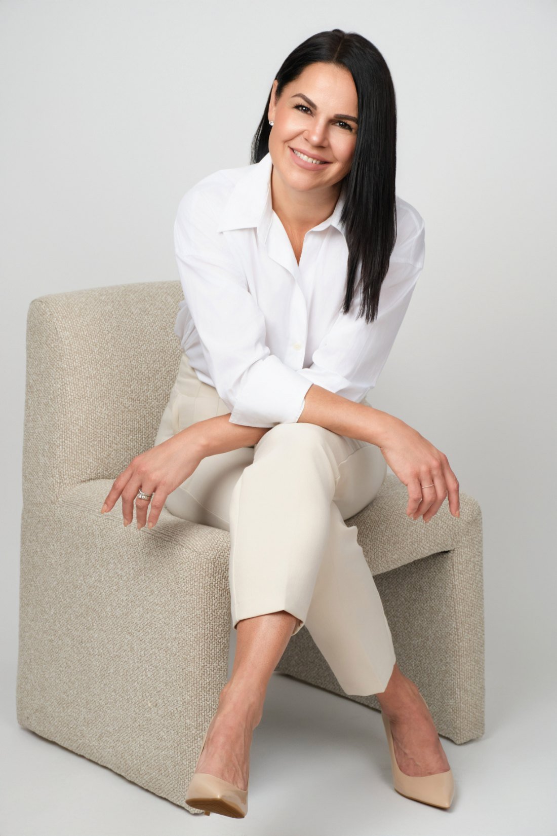 Personal branding portrait of a business owner seated in a bright Langley studio, Volkan Photography
