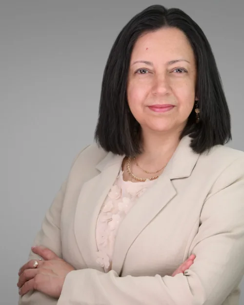 On-site headshot of Claudia Barbosa photographed at her office with a mobile studio