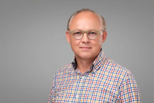 Team headshot of Miiks Makela of Collective Technologies on a grey backdrop