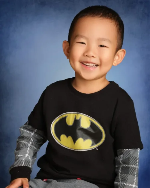A grinning student photographed during a school picture day