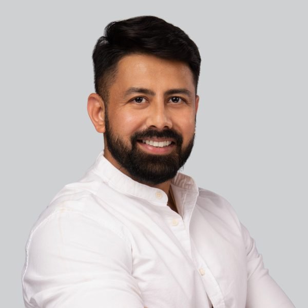 Event headshot booth portrait of a bearded man in a white shirt