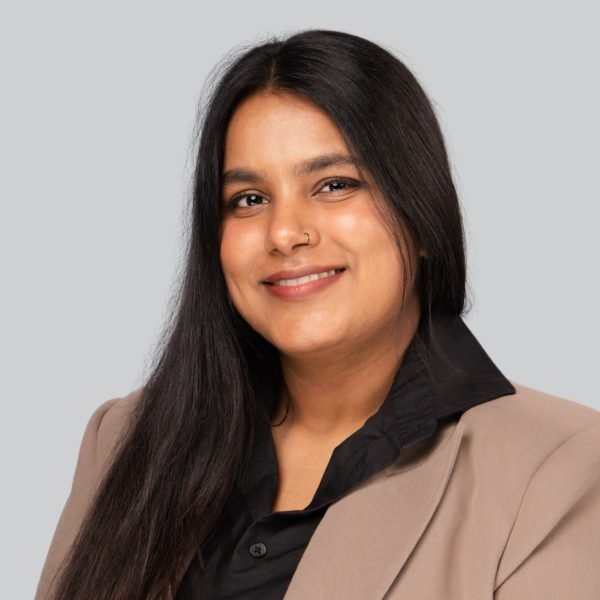 Event headshot booth portrait of a woman in a tan blazer