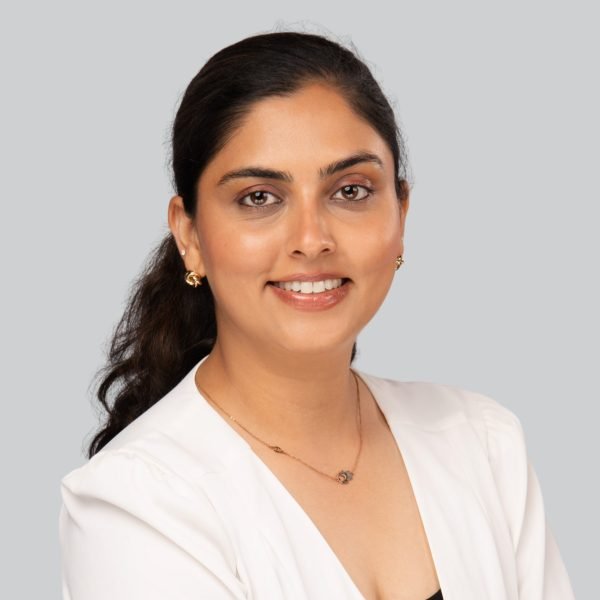 Event headshot booth portrait of a woman in a white blazer