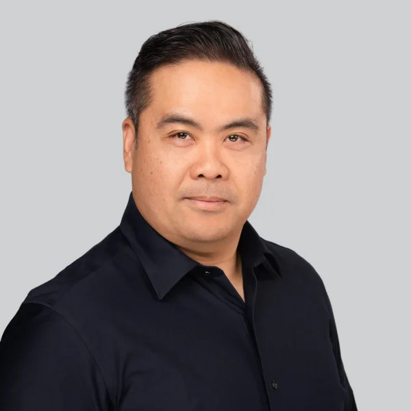 Event headshot booth portrait of a man in a black shirt