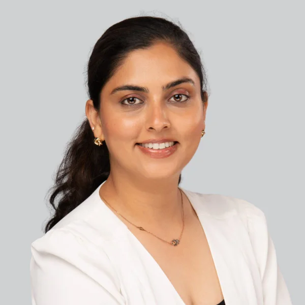Event headshot booth portrait of a woman in a white blazer