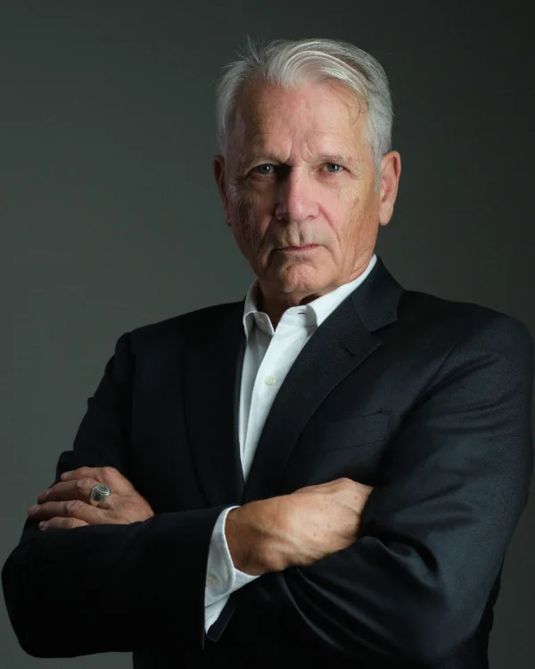 Actor headshot of a mature male performer with dramatic studio lighting