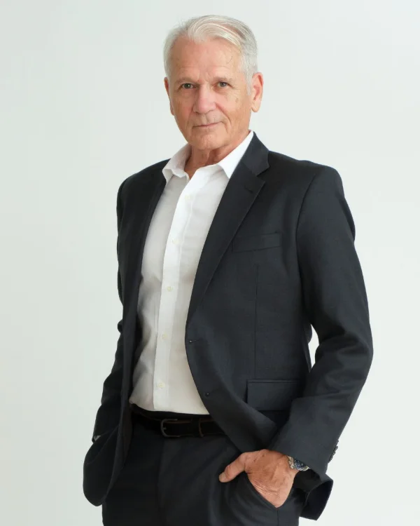 Three-quarter length actor headshot of a mature male performer