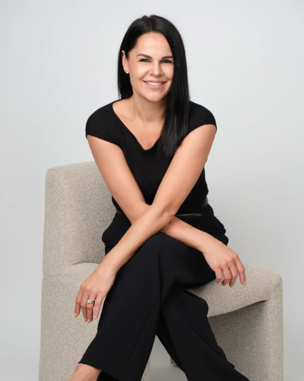 Seated personal branding portrait of Corinne Pederson in the Langley studio