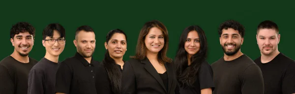 Group team photo of the Willow Wellness Group photographed on a dark background