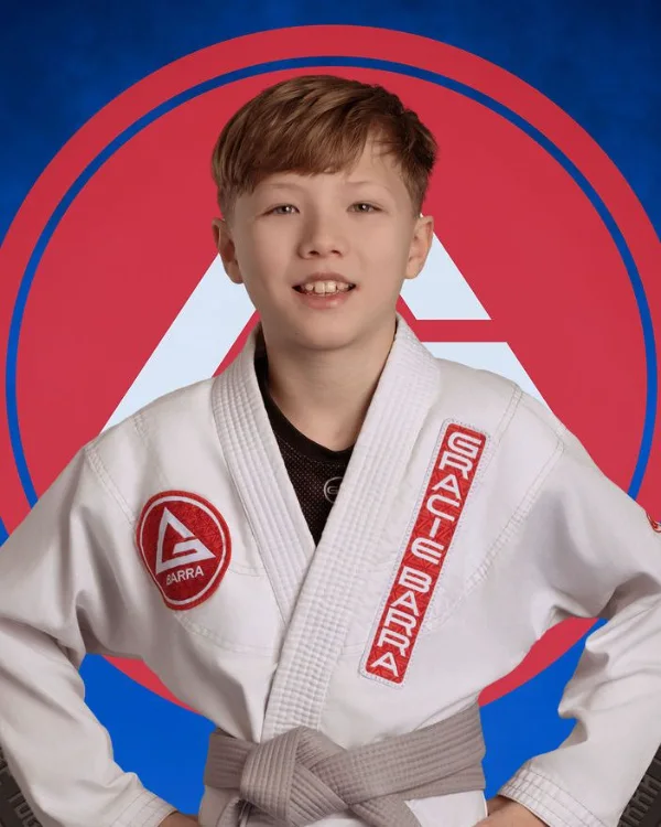 Teen jiu-jitsu student belt portrait photographed at a grading day