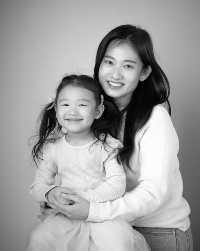 Black and white portrait of a mother and daughter, one panel of a three-piece triptych set