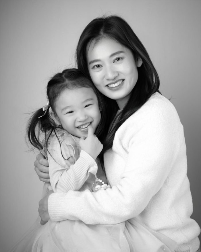 Black and white portrait of a mother and daughter, one panel of a three-piece triptych set
