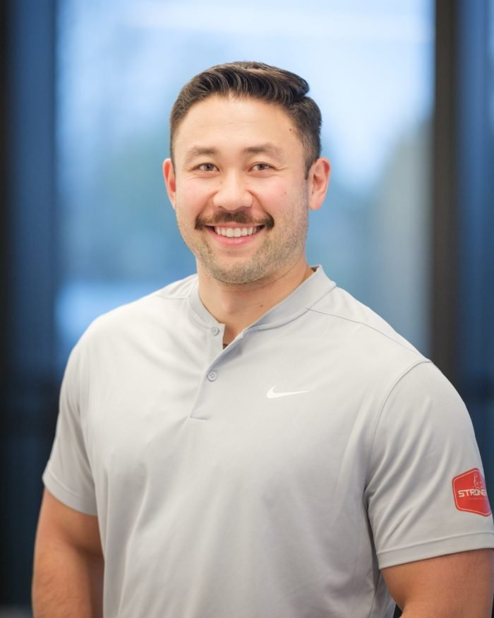 On-location staff headshot photographed for the Strongarm Swamping and Labor team