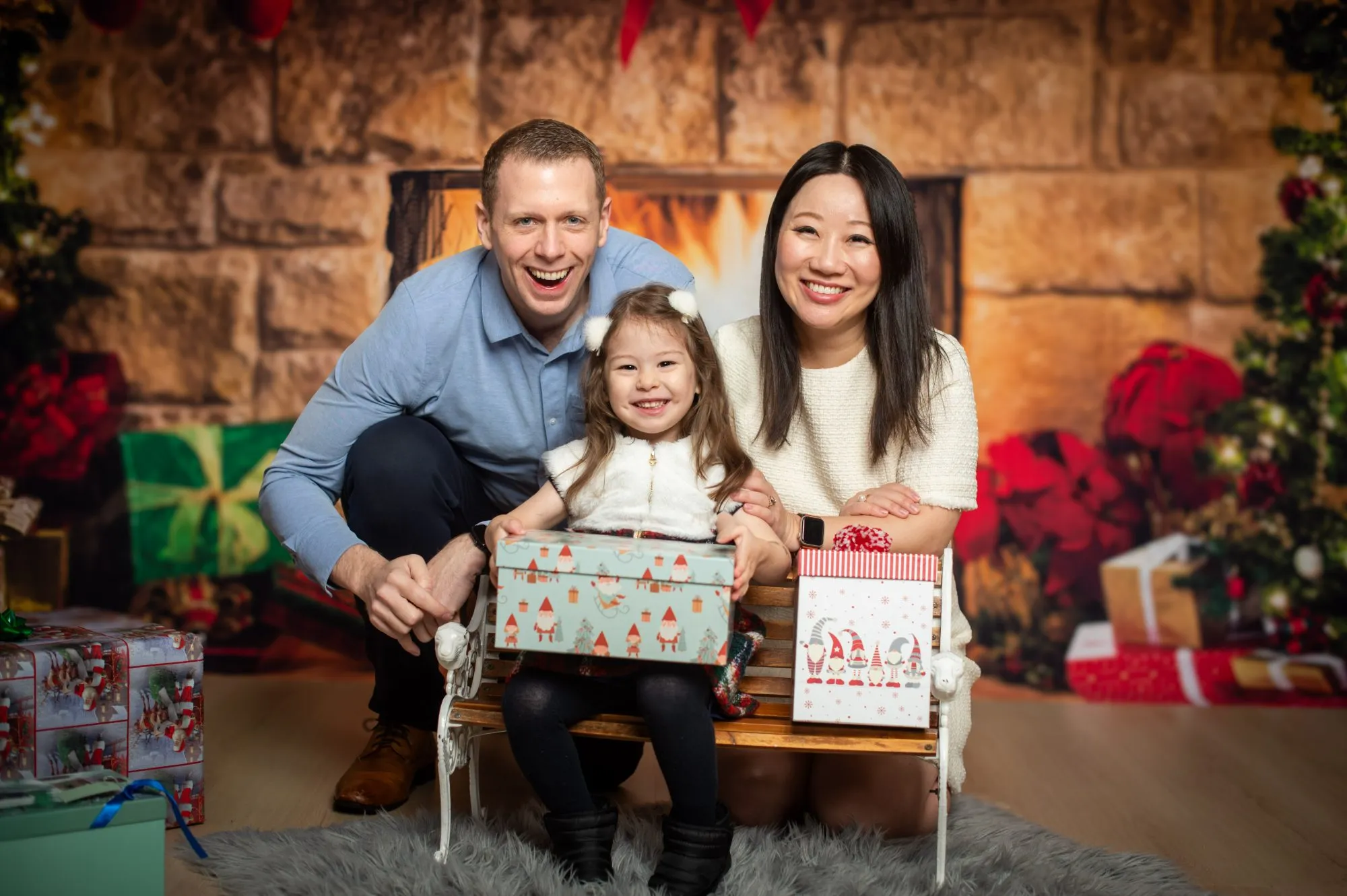 Extended family portrait on a white studio backdrop