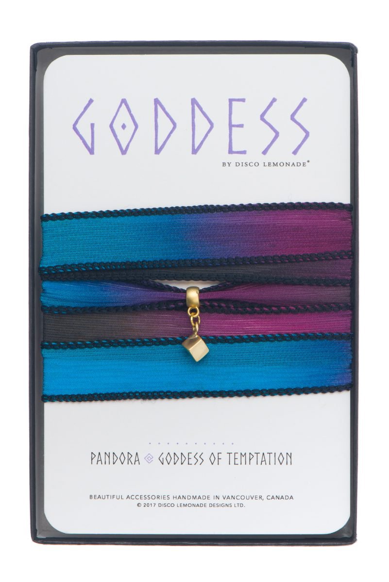 Retail packaging photography of a silk wrap bracelet presented in its printed gift box