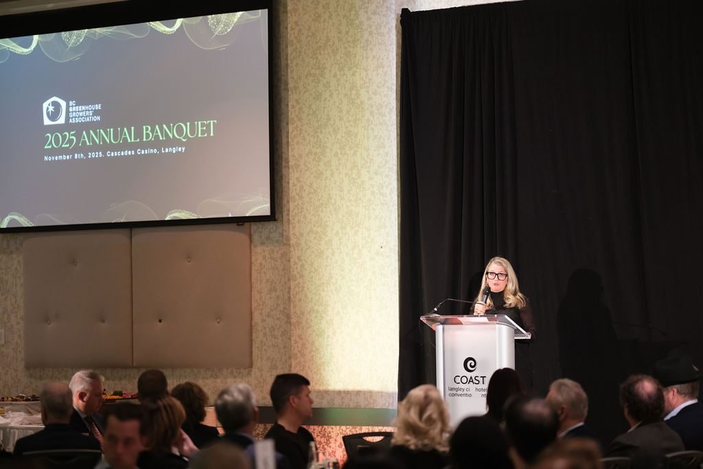 Speaker at the podium during an association annual banquet in a Vancouver hotel ballroom