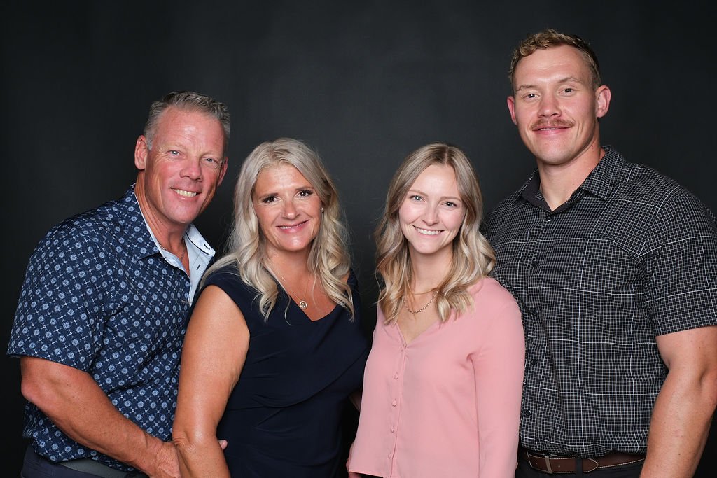 Group of four guests photographed together at the gala portrait booth