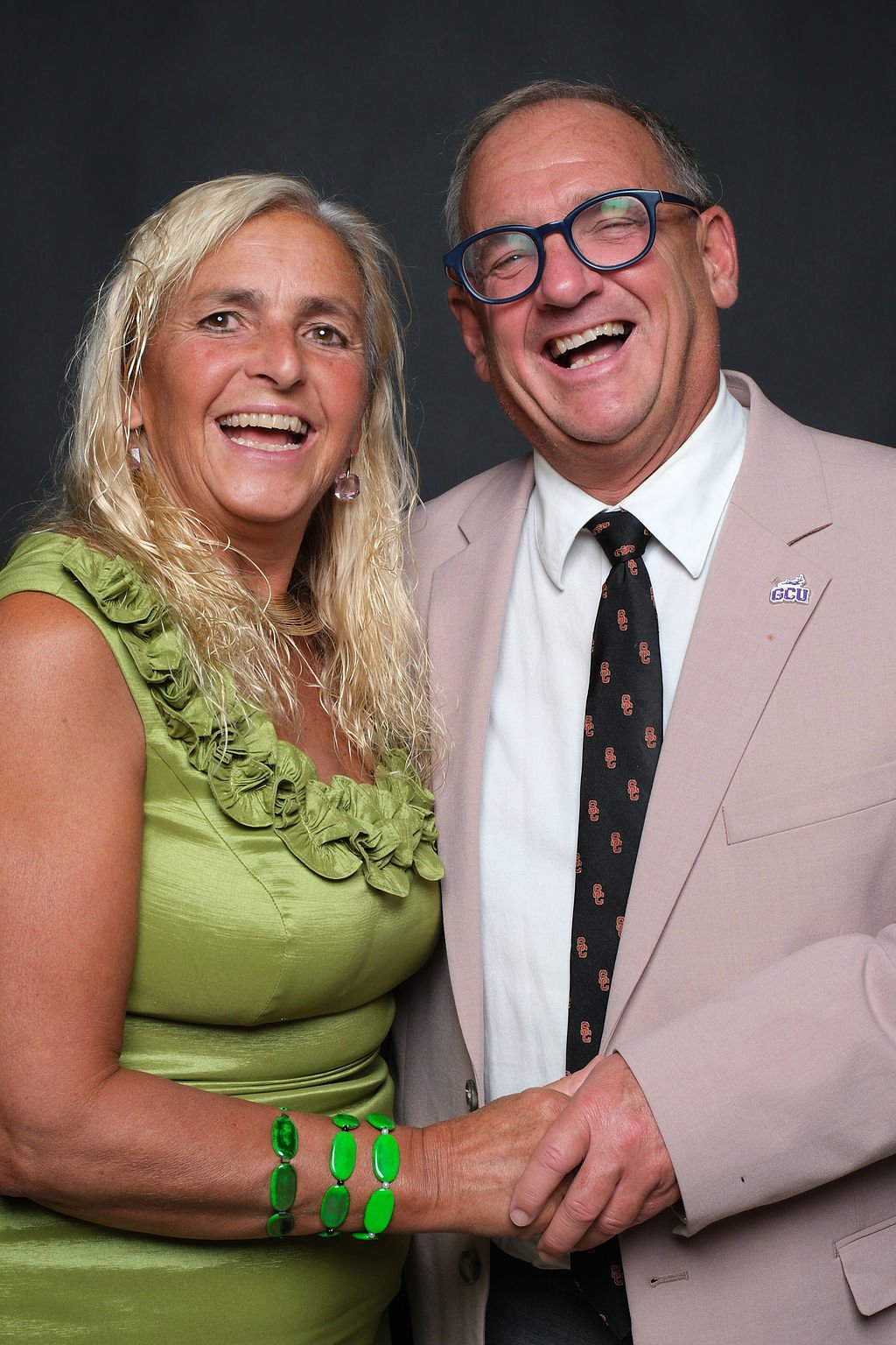 Two guests posing back to back and laughing at the gala portrait booth