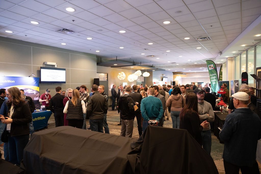 Delegates moving through the exhibit hall at an industry trade show in Vancouver