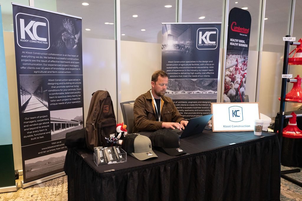 Exhibitor at a branded trade show booth during a BC industry conference