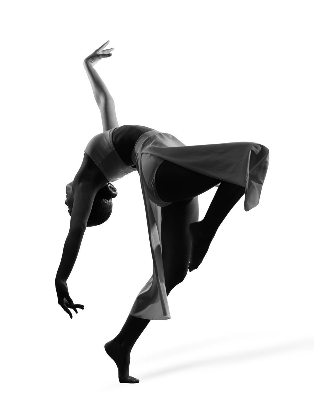 Contemporary dance portrait in a black leotard on a white background