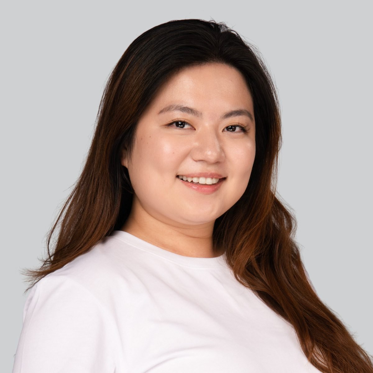 Event headshot booth portrait of a woman in a white top