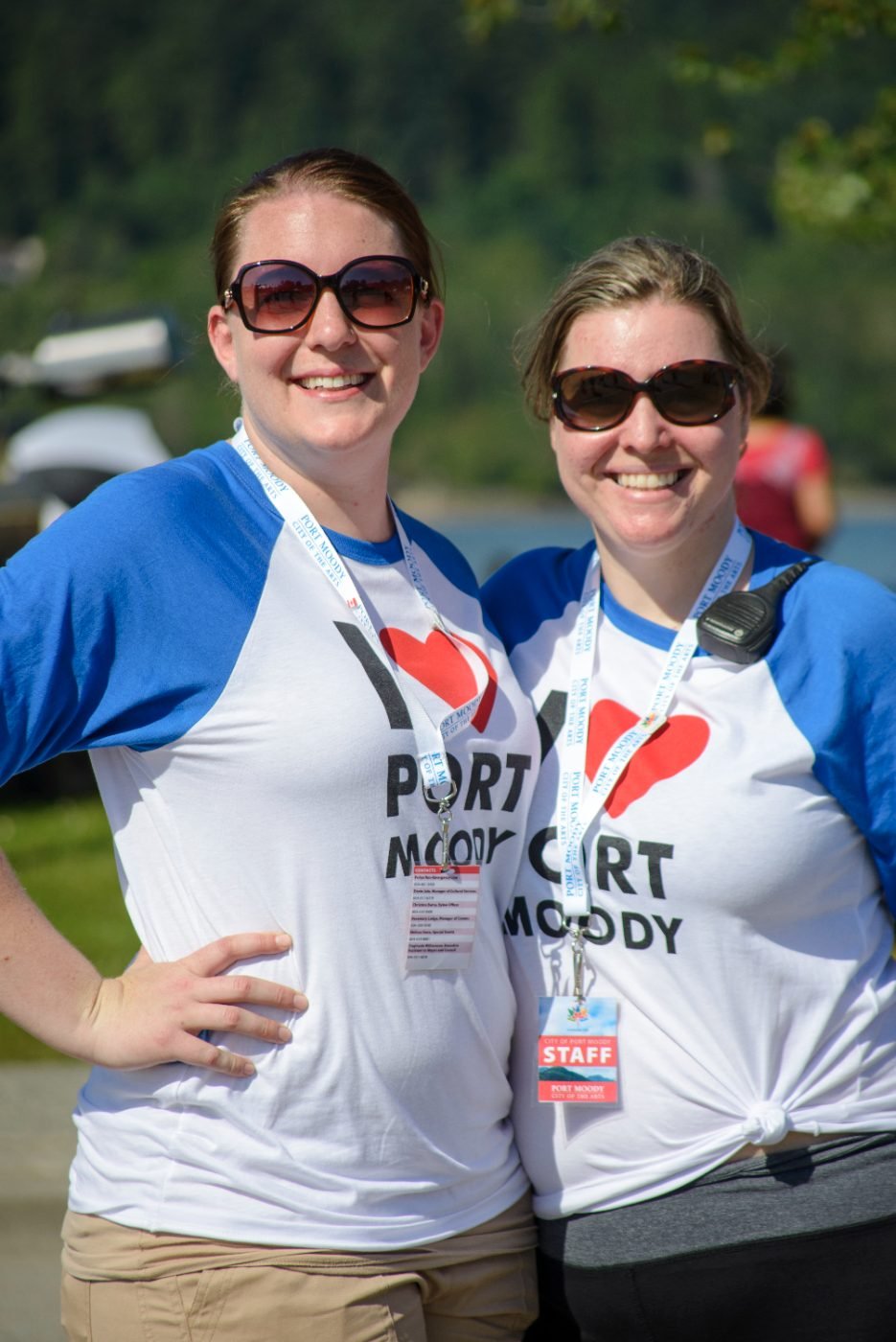Two festival volunteers photographed together in their event shirts