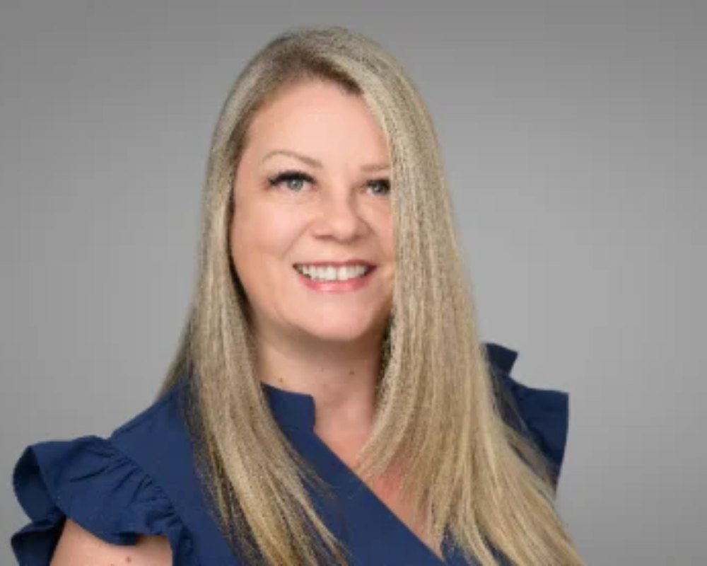 Professional headshot photographed in the Langley studio