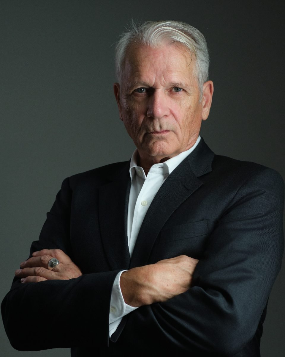 Actor headshot of a mature male performer with dramatic studio lighting