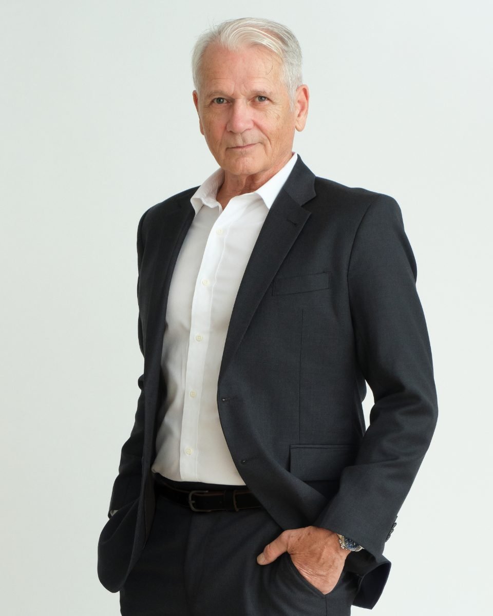 Three-quarter length actor headshot of a mature male performer