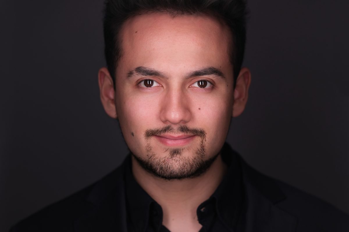 Theatrical actor headshot with moody lighting photographed in Langley BC
