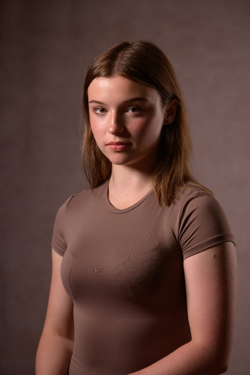 Teen actress headshot photographed on a dark backdrop in Vancouver