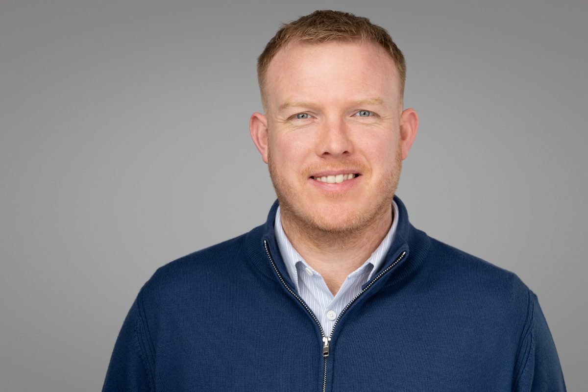 Corporate team headshot of Alun photographed for Arndt on a grey backdrop