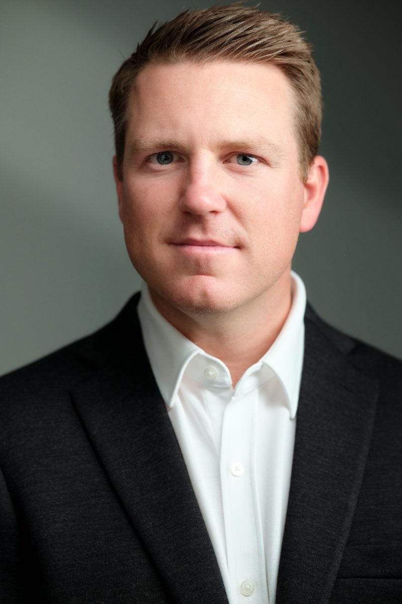 Executive headshot of Danny Horner on a green studio backdrop in Langley BC