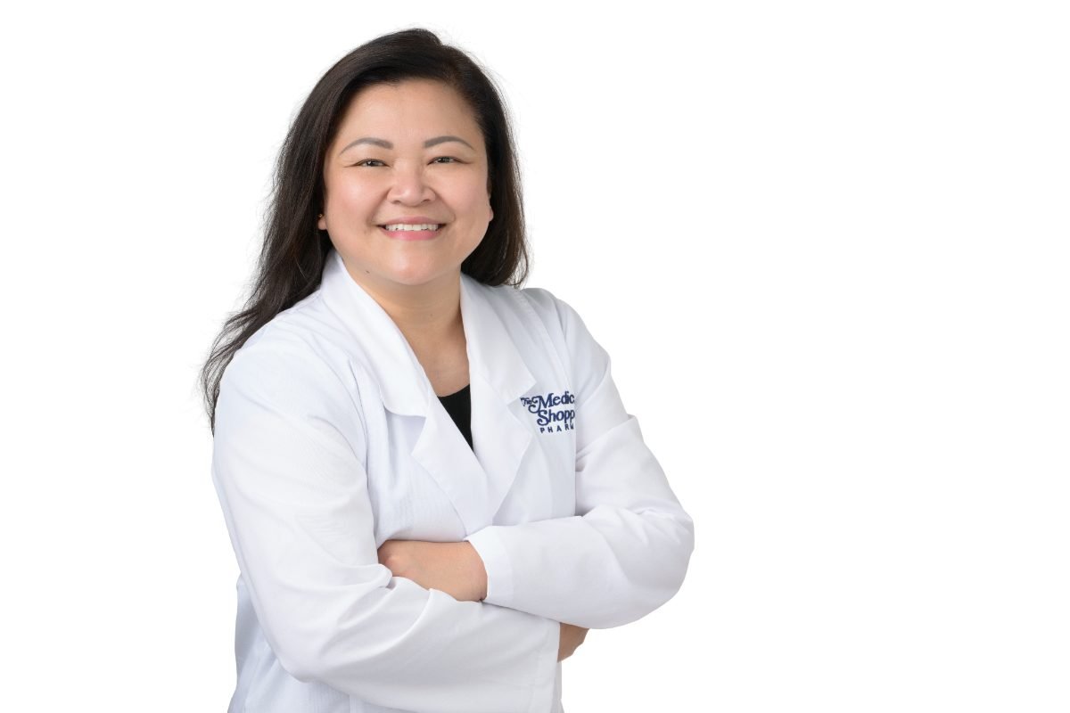 Physician headshot of Melissa Santiago in a white coat for a clinic website