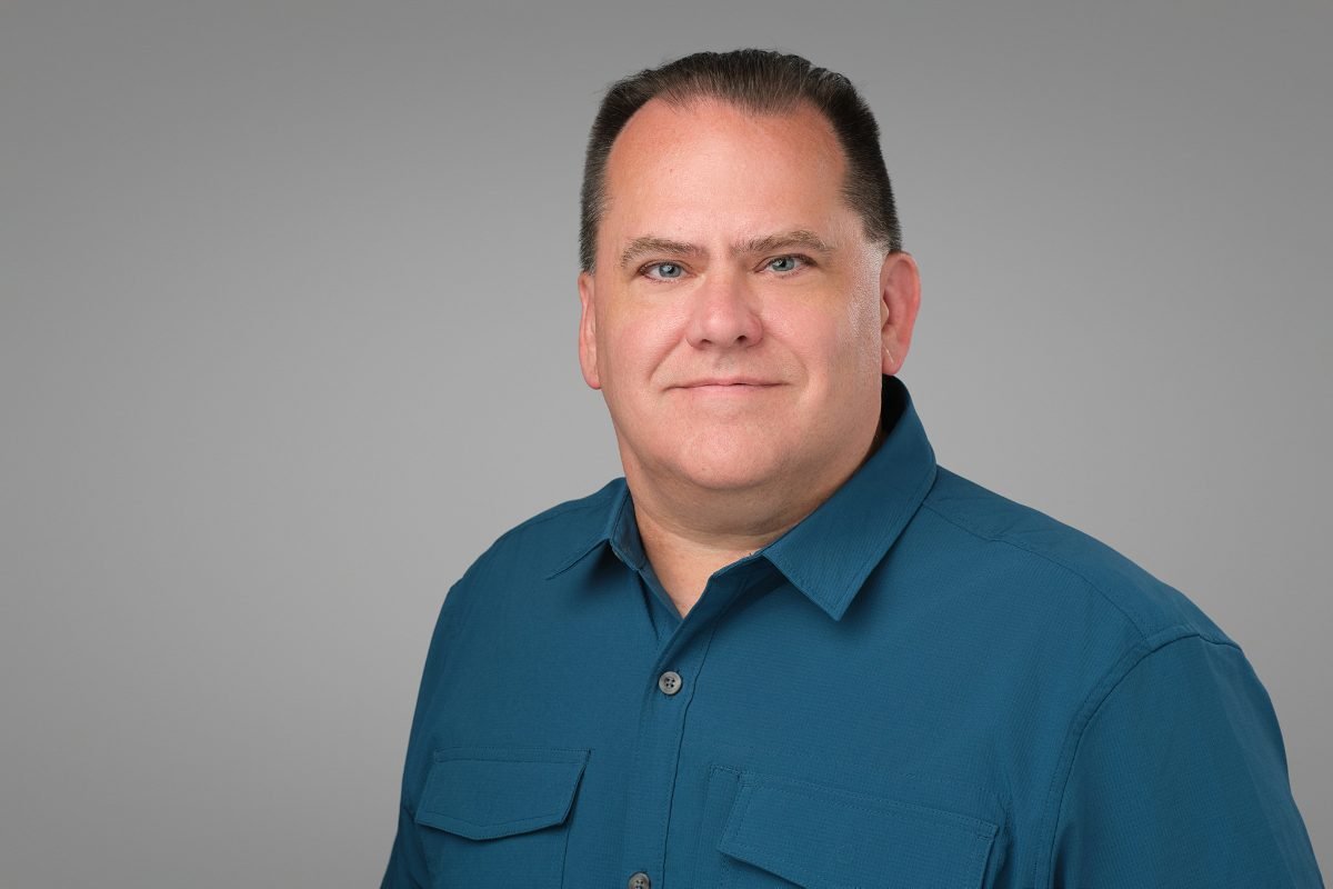 Team headshot of Brian Harrison of Collective Technologies photographed on site