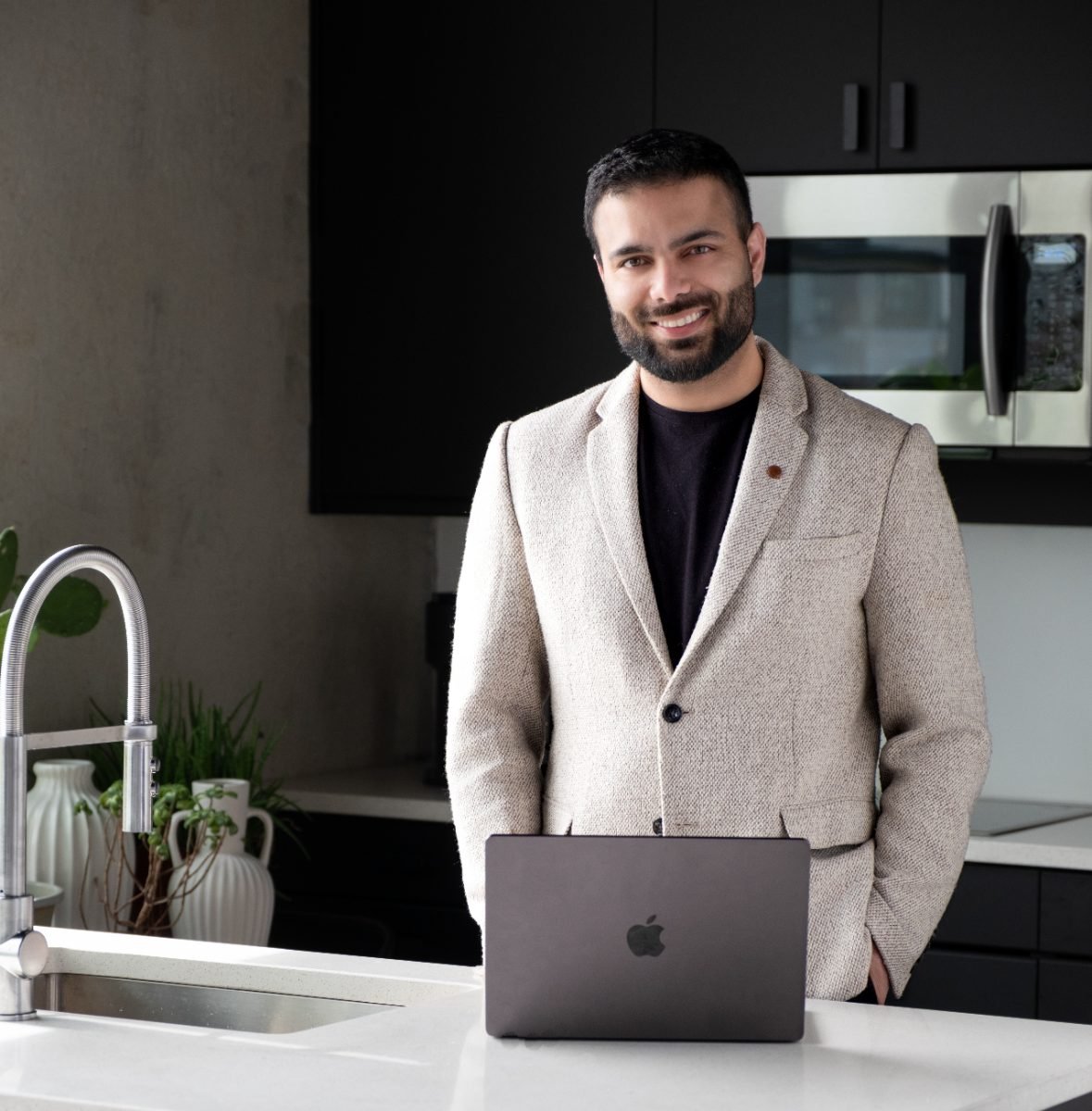 On-location branding portrait of a business owner in a studio kitchen