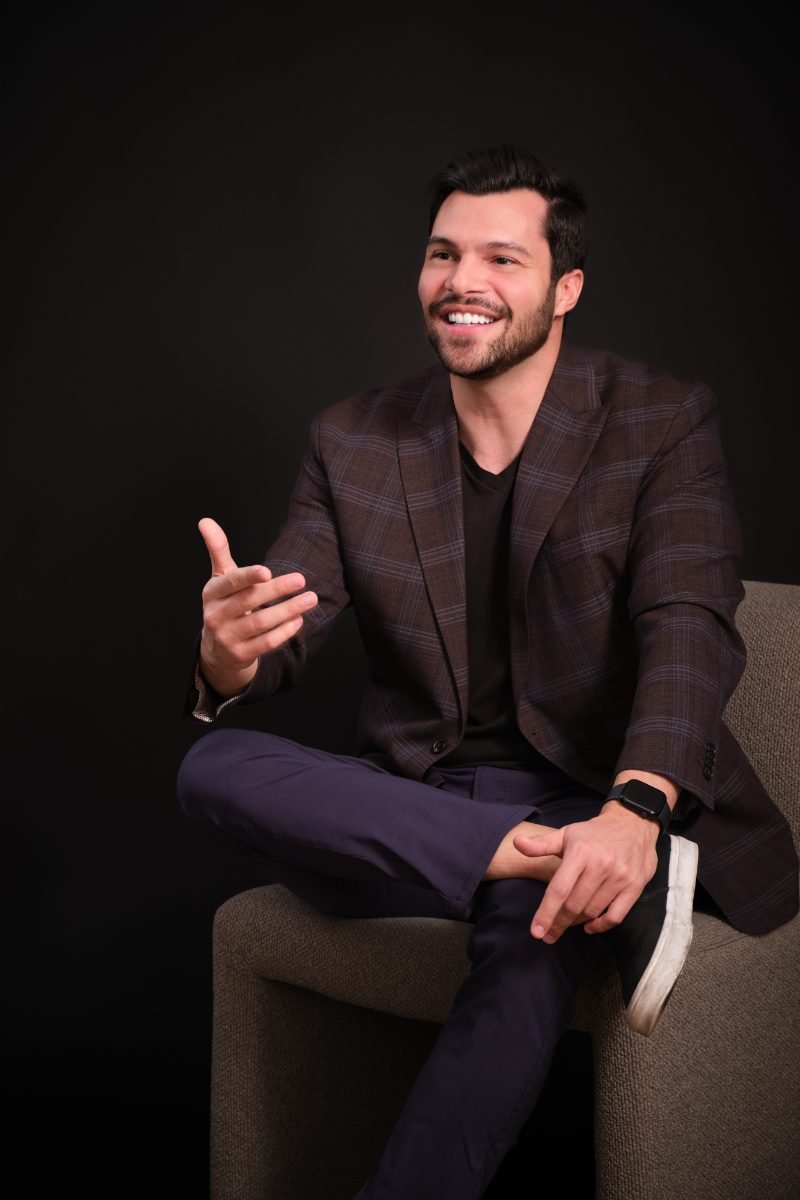 Seated personal branding portrait of Murilo Tavares photographed in Langley BC