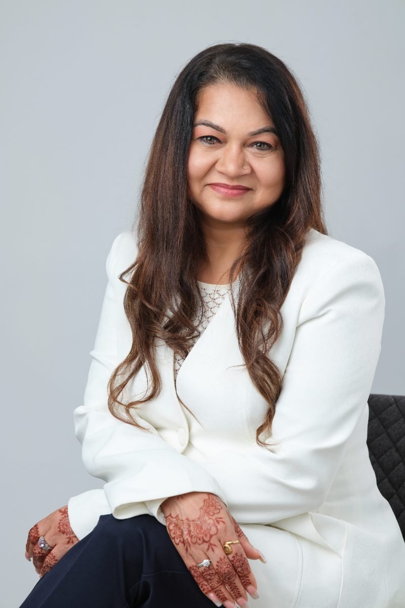 Seated personal branding portrait of Naiya Gill photographed in Langley BC