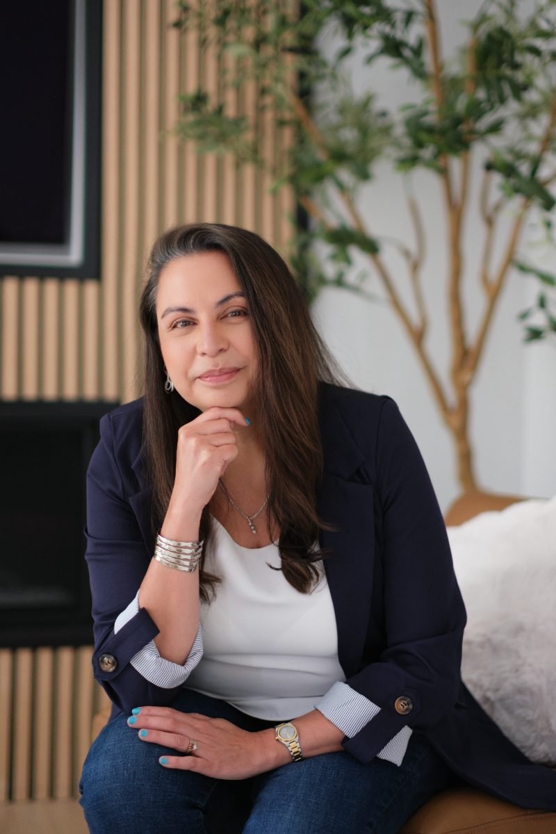 Personal branding portrait photographed in a modern office setting