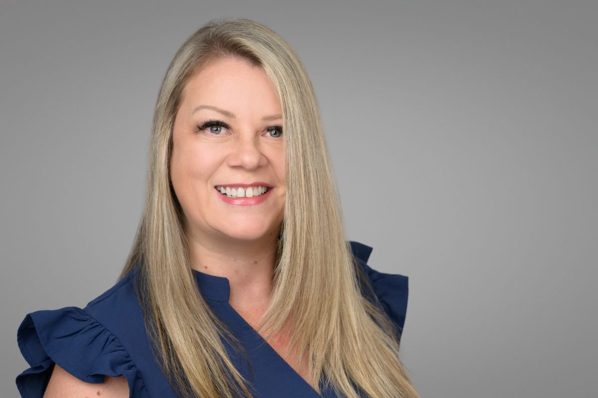 Clinician headshot of Lina Lilley on a grey studio backdrop