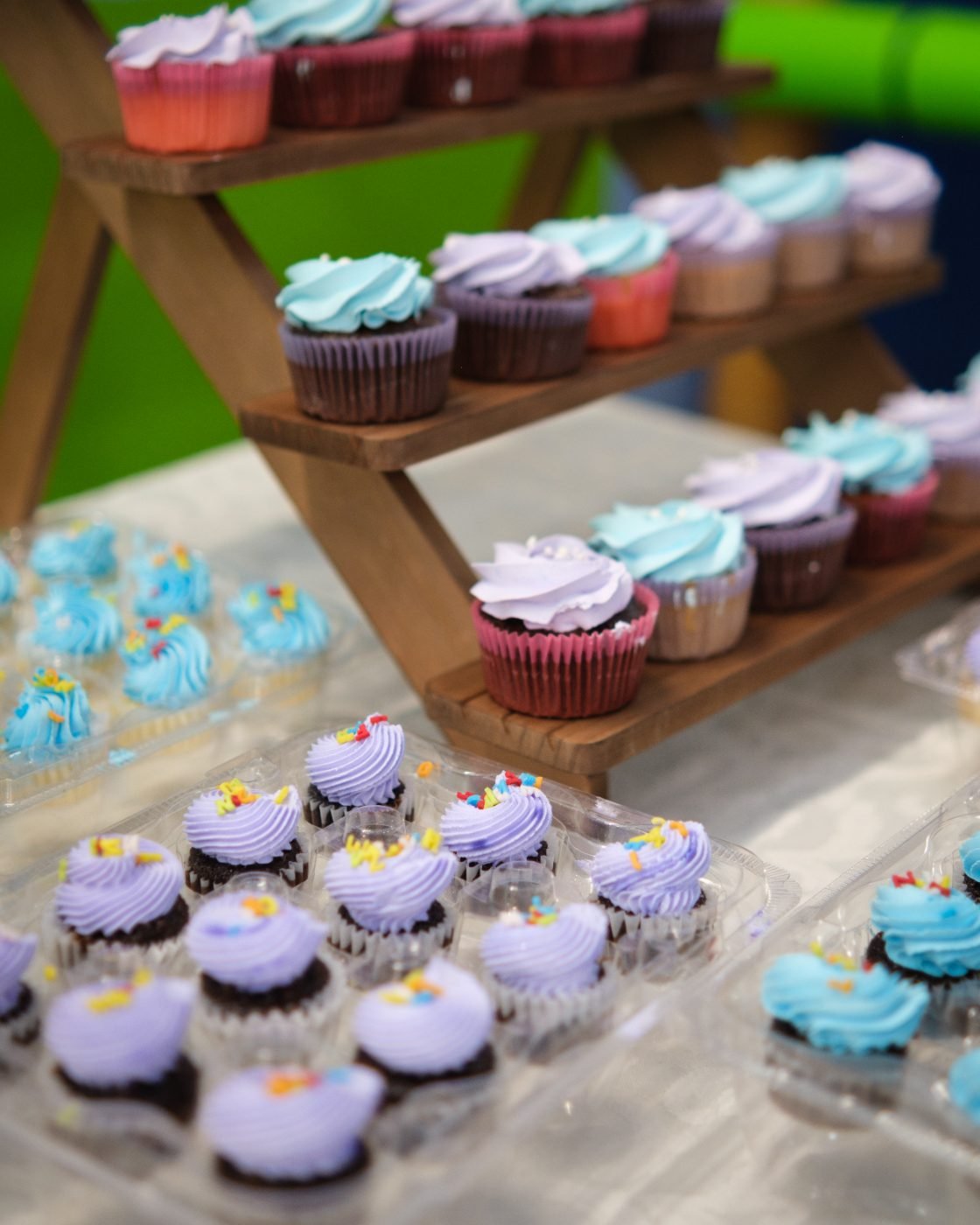 Pastel cupcake tower photographed as a detail before guests arrive at a birthday party