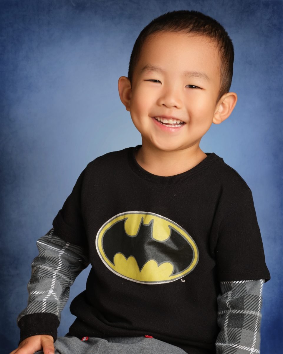 A grinning student photographed during a school picture day