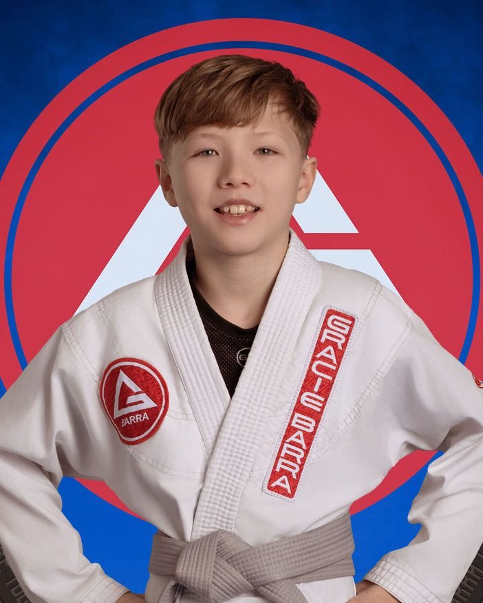 Teen jiu-jitsu student belt portrait photographed at a grading day