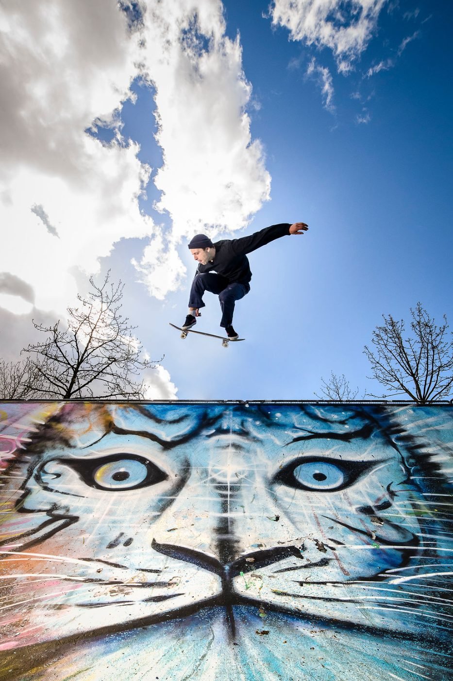 Skateboarder mid-air above a bowl at a Lower Mainland skate park