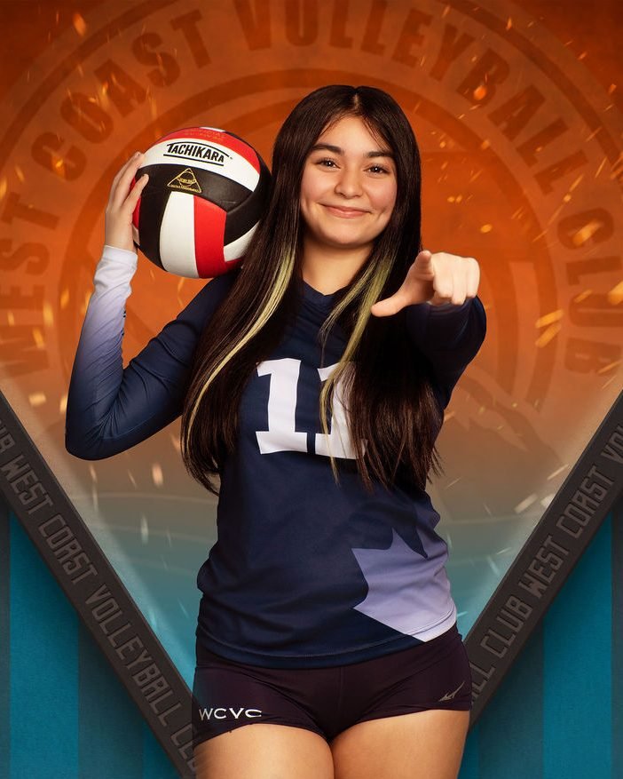 Volleyball athlete banner portrait holding the ball at her shoulder