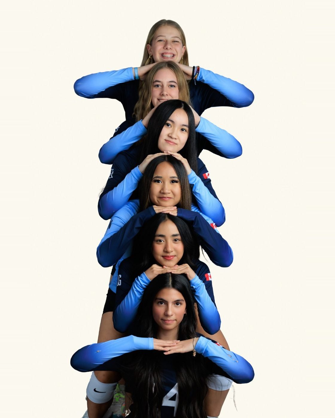 Creative stacked group portrait of a volleyball team in the studio
