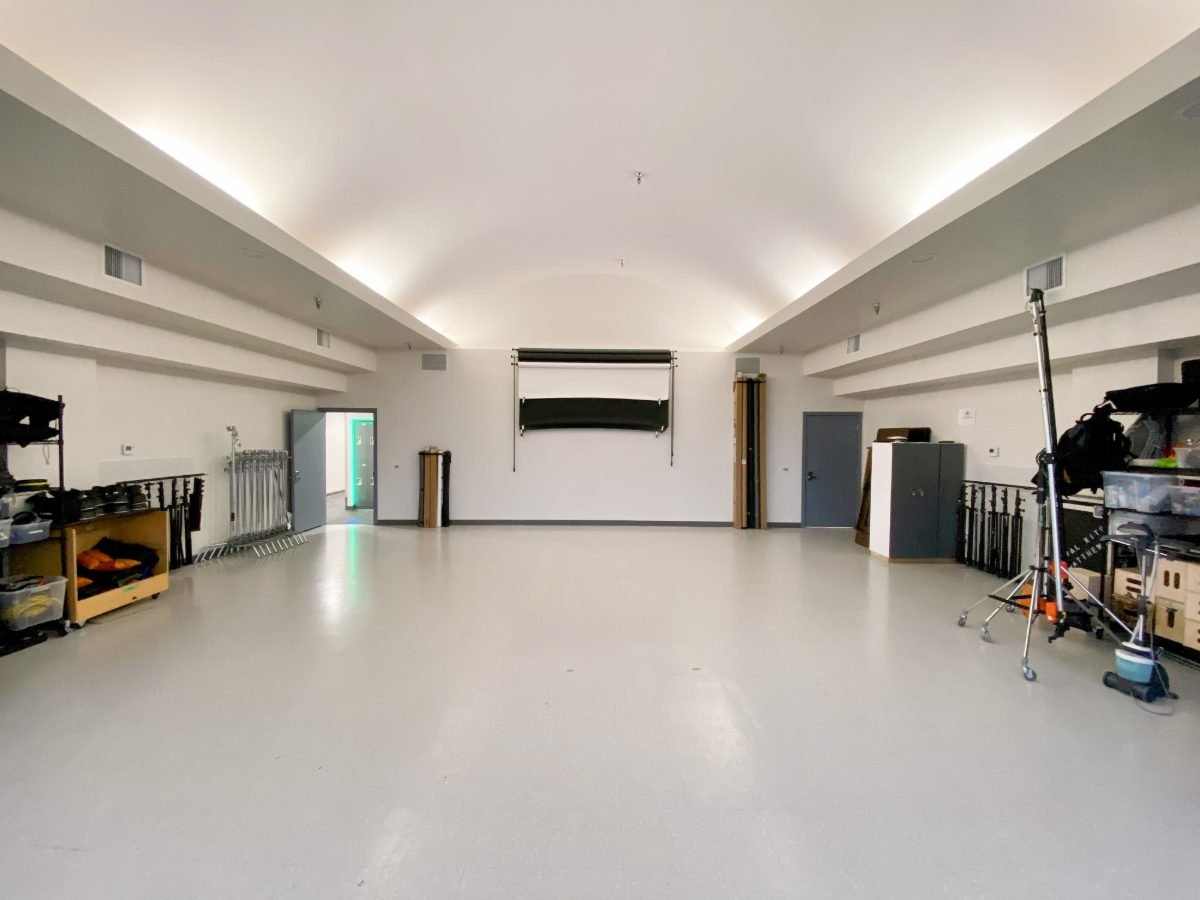 Shooting area at the Vancouver studio on Terminal Avenue with a backdrop on the wall and lighting stands ready